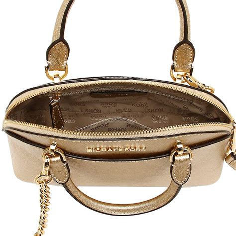 michael kors gold handbag is for reglar use|Michael Kors leather handbag.